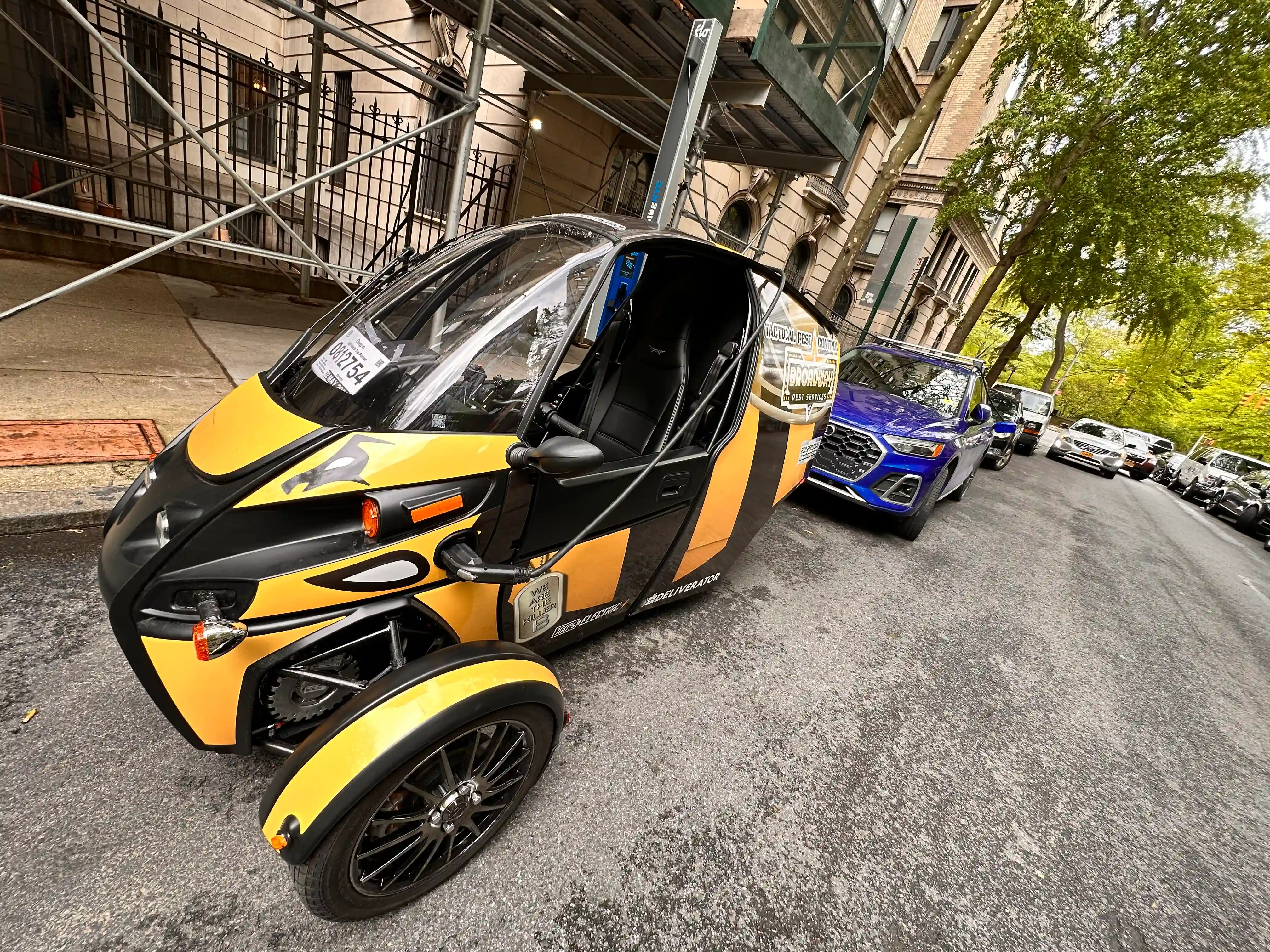Broadway Pest Services Arcimoto FUV electric three-wheeled service vehicle on NYC street