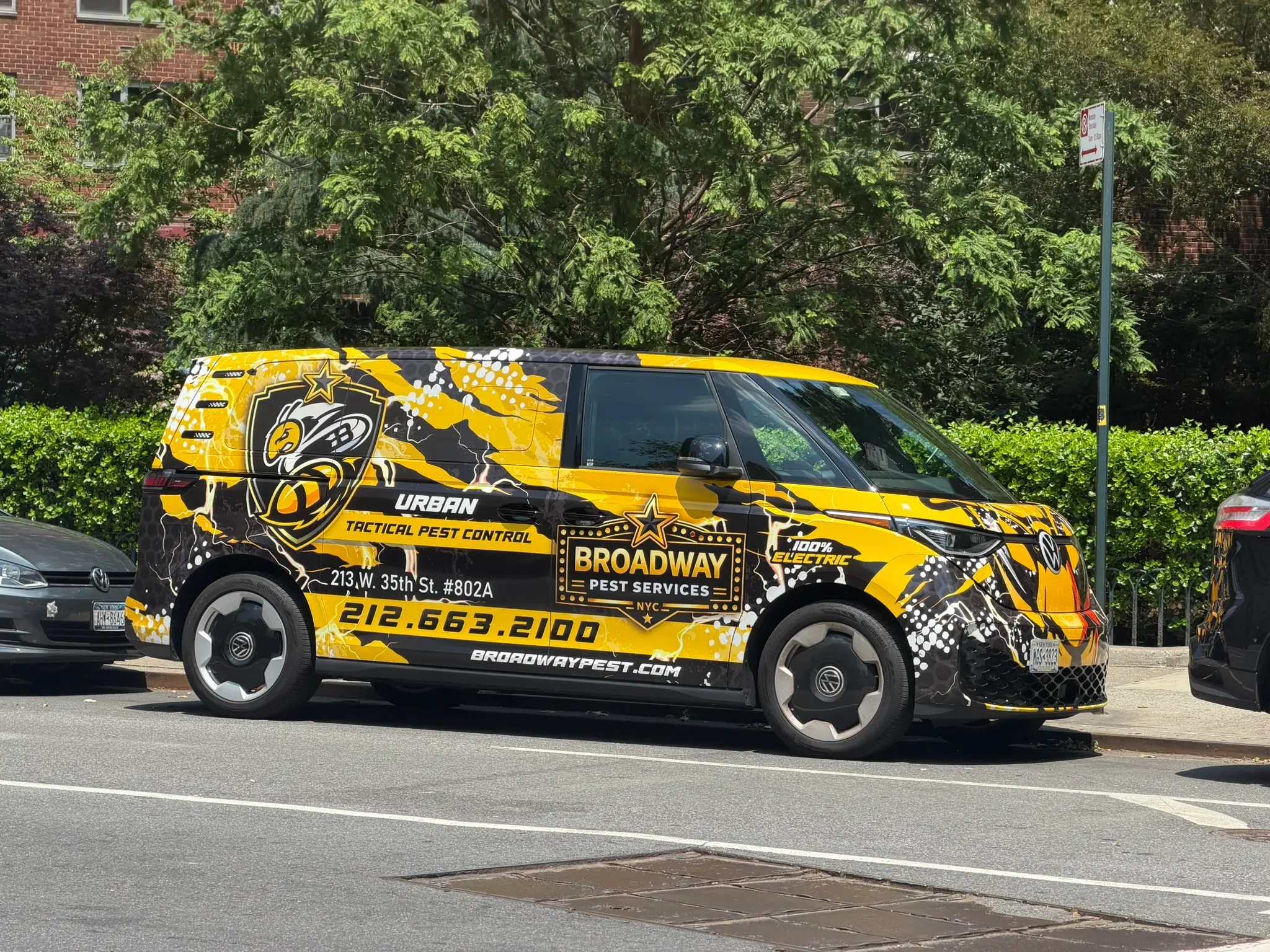 Broadway Pest Services VW ID Buzz all-electric service van parked on NYC street showing Urban Tactical Pest Control branding