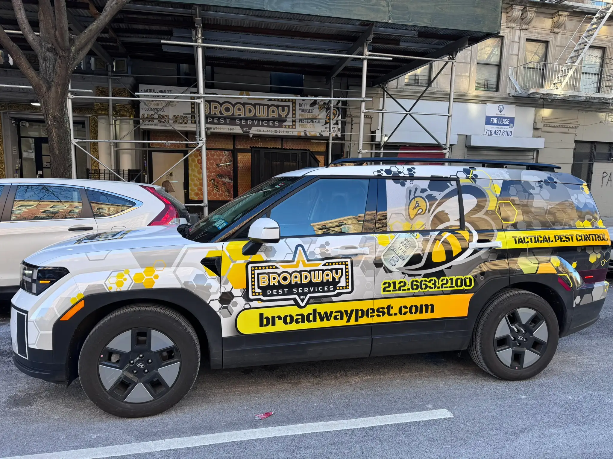 Broadway Pest Services Hyundai Santa Fe Hybrid service vehicle with full vehicle wrap in NYC